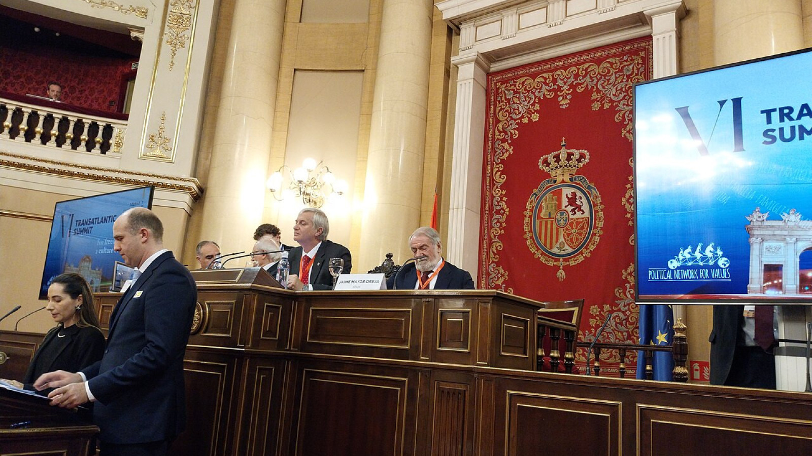 a group of persons at a conference